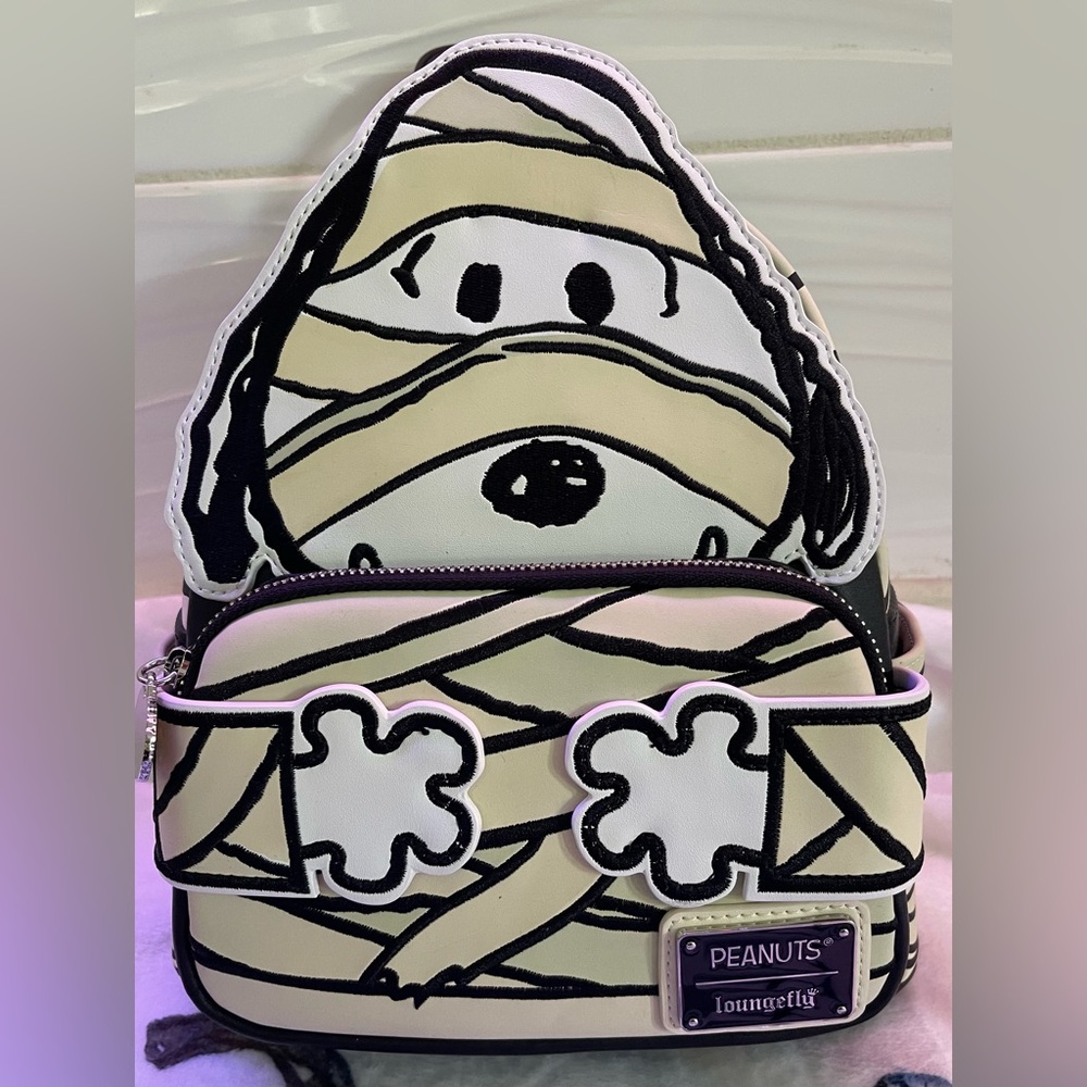 NWT… Loungefly Peanuts Snoopy Mummy Cosplay Glow mini backpack